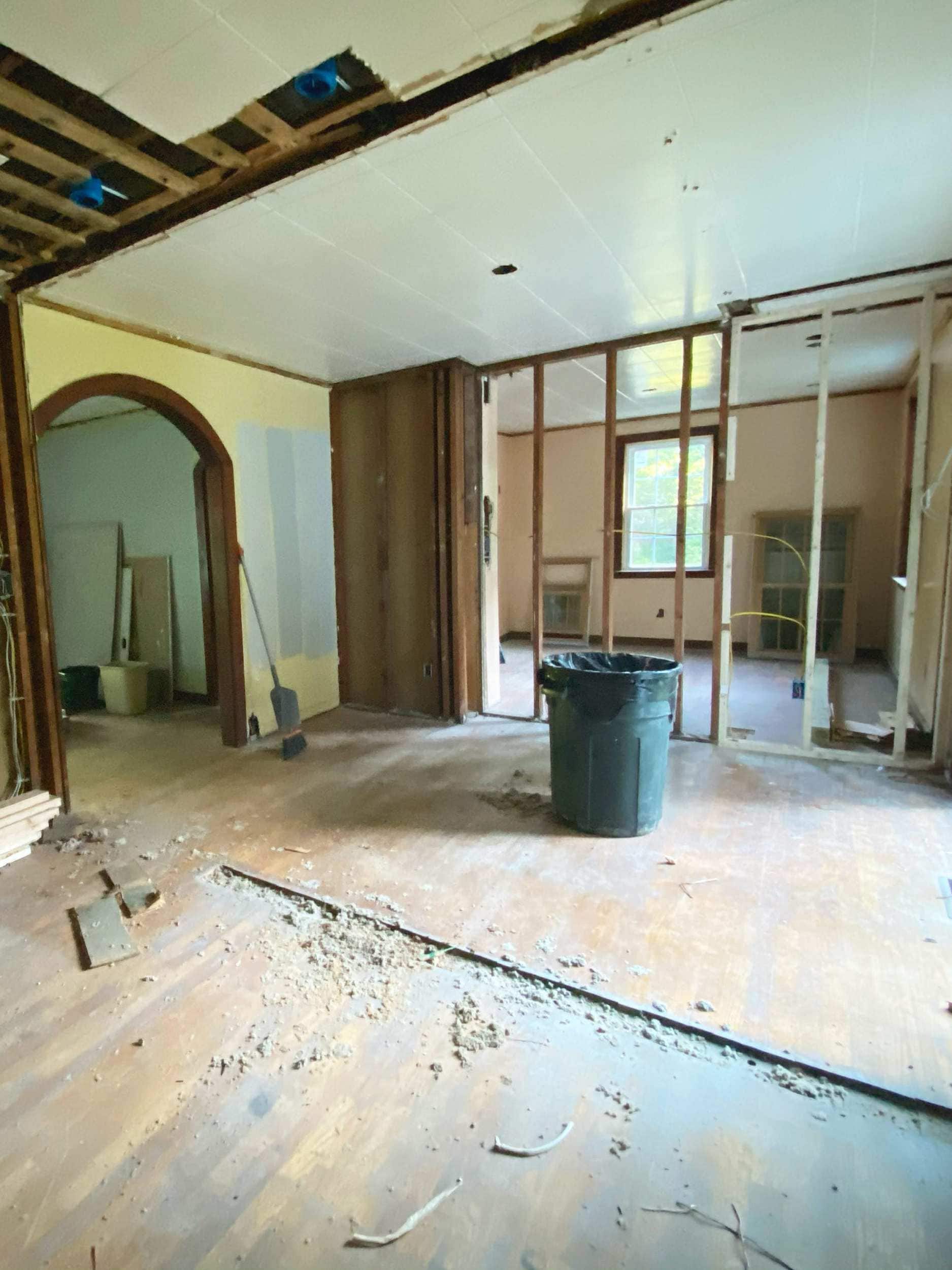 The kitchen with the dining room wall torn down during construction 
