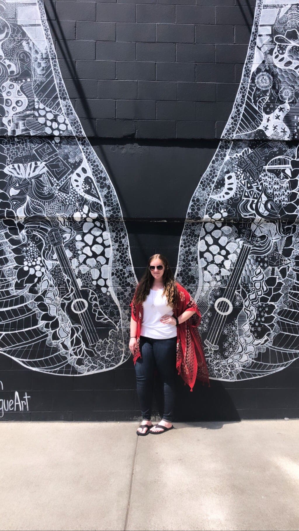 Michelle Frohman, author of the Acorn Hill Home Blog at the Nashville WhatLiftsYou Wings Mural
