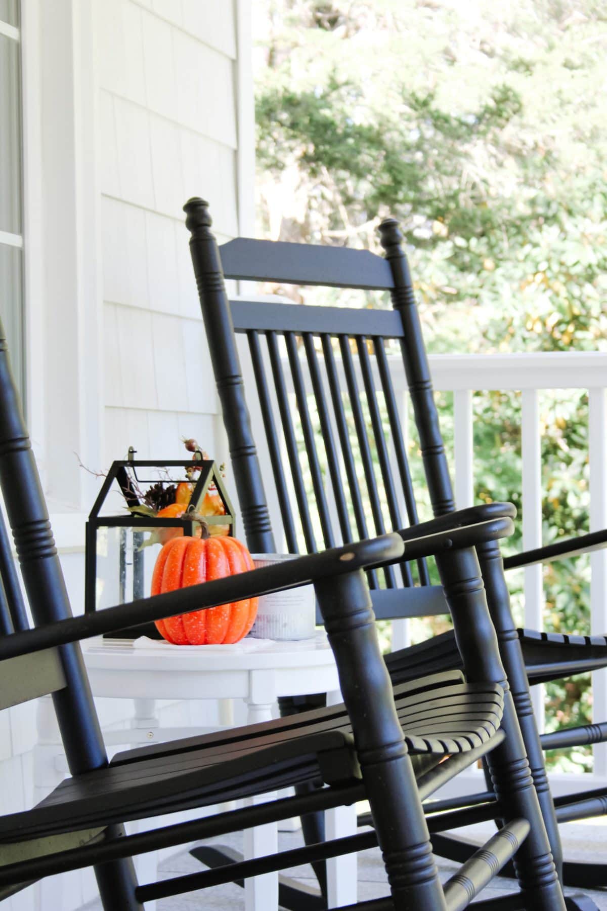 black weathered rocking chairs on a front porch during fall