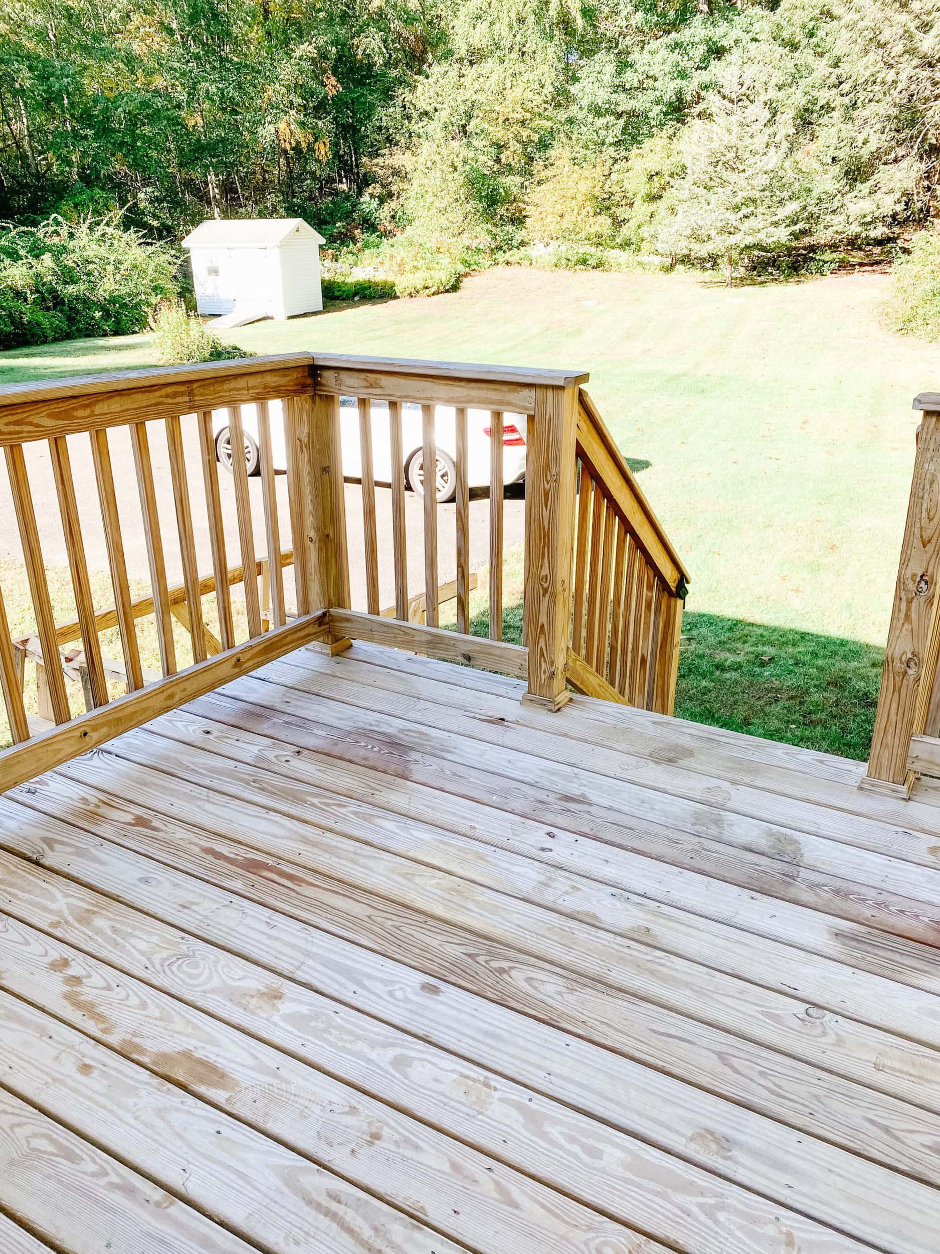 Pressure treated wood deck stained with sherwin williams superdeck in pure white and impossible gray 