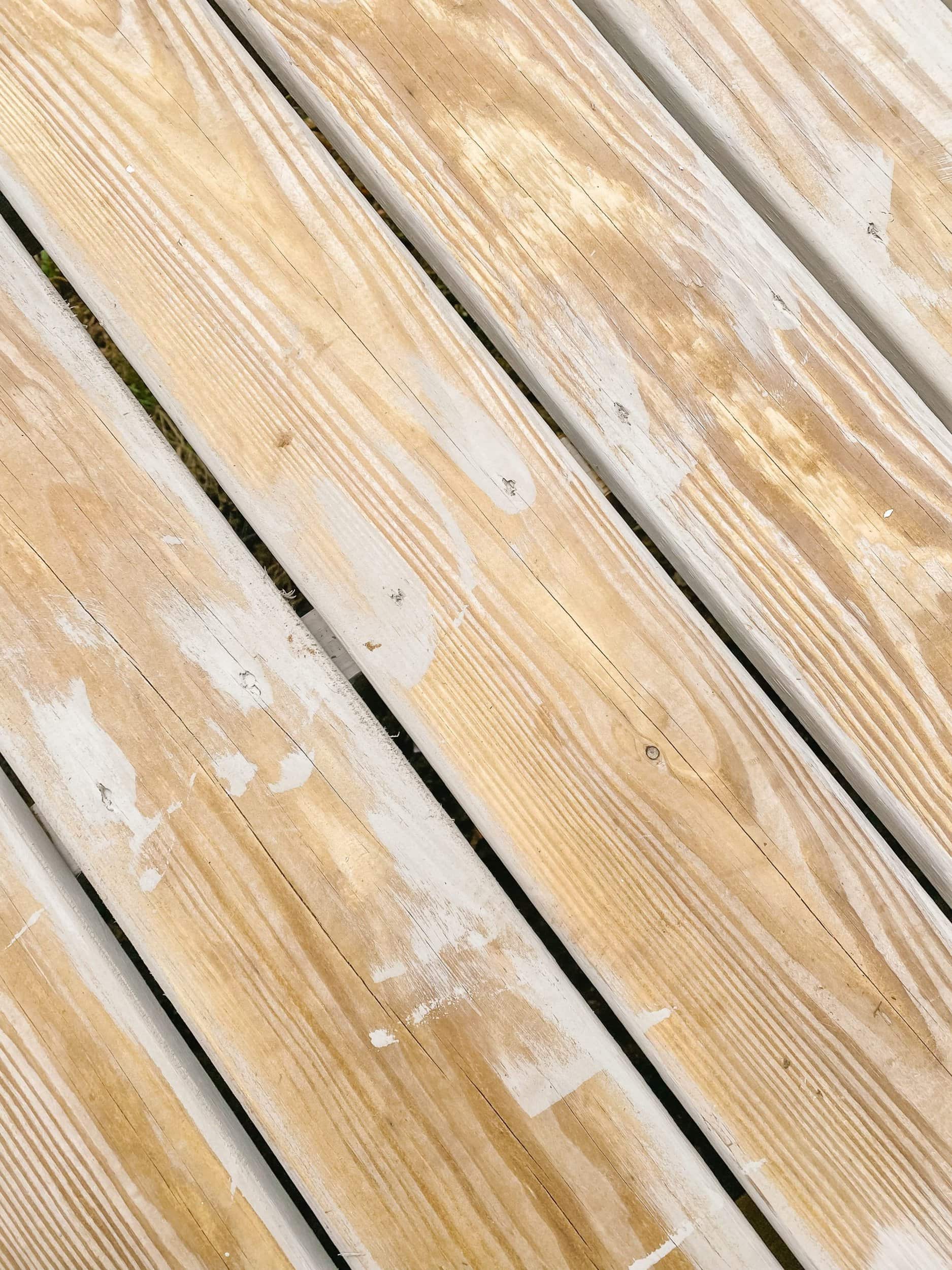 Staining between the boards and the nail heads of a pressure treated deck