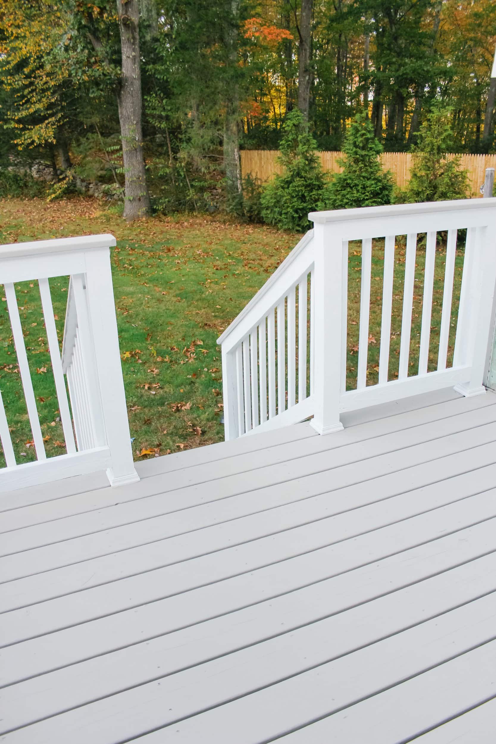 Pressure treated wood deck stained with sherwin williams superdeck in pure white and impossible gray 