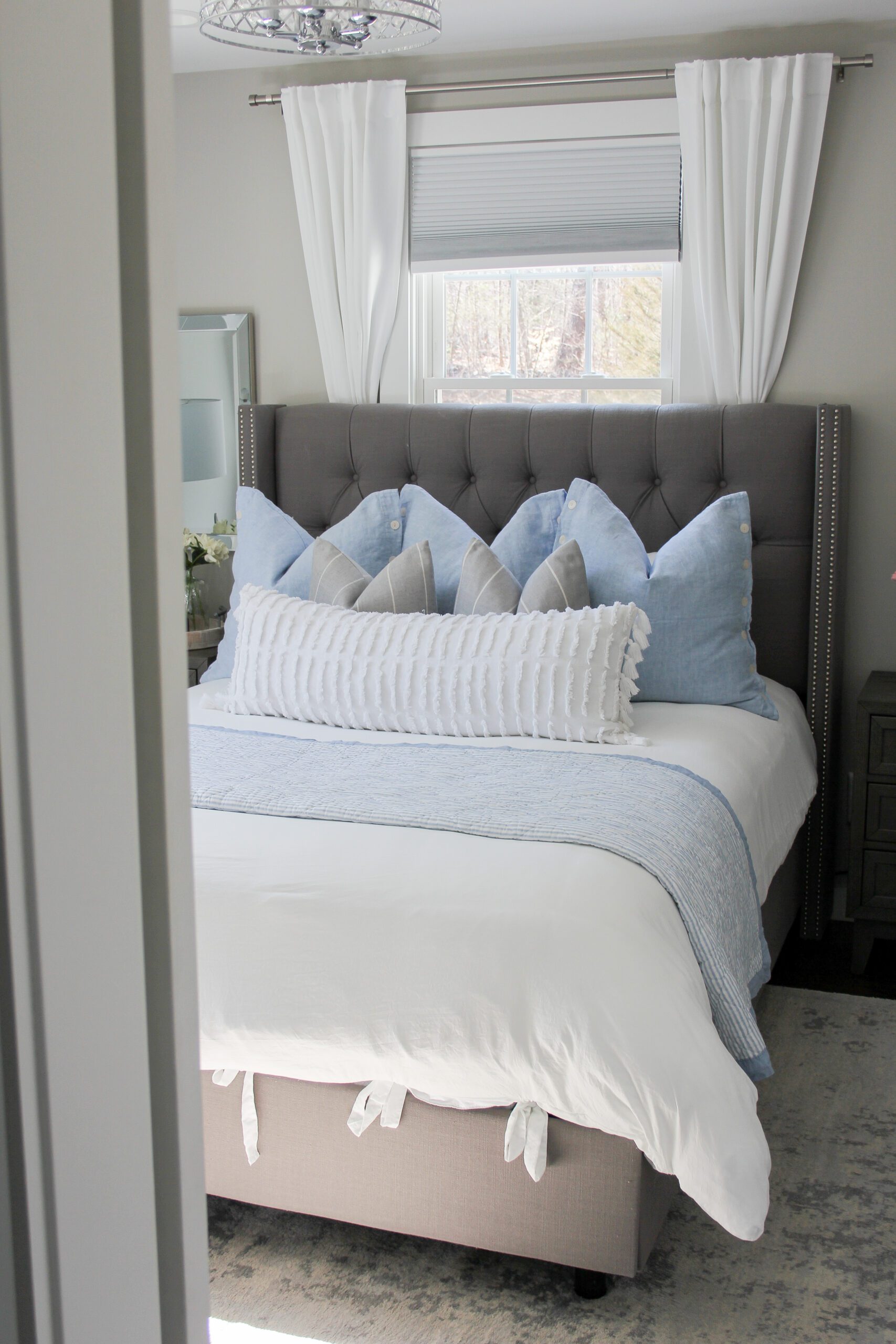 modern farmhouse cottage bedroom with a pop of blue