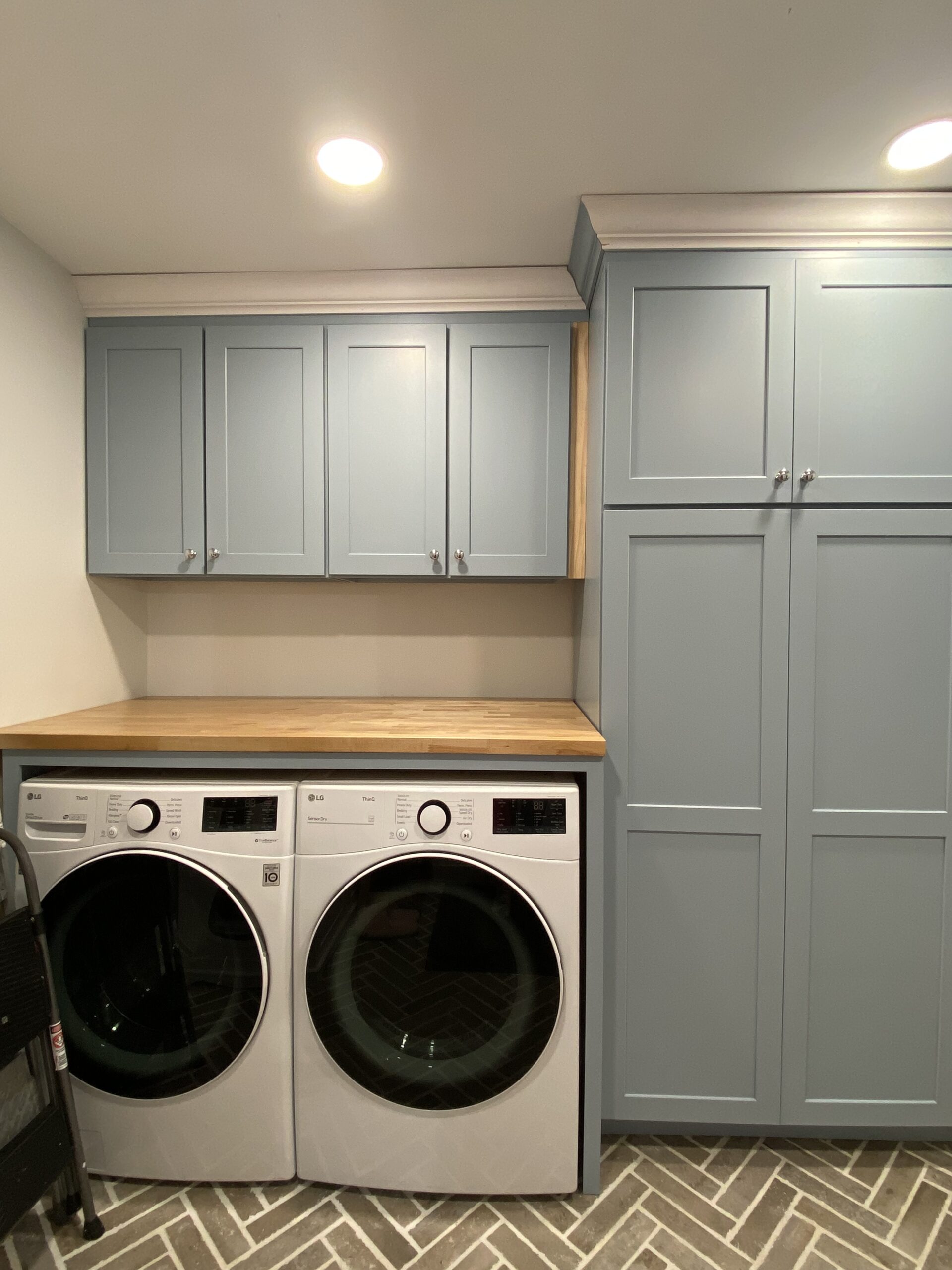 Laundry room with crown molding installed